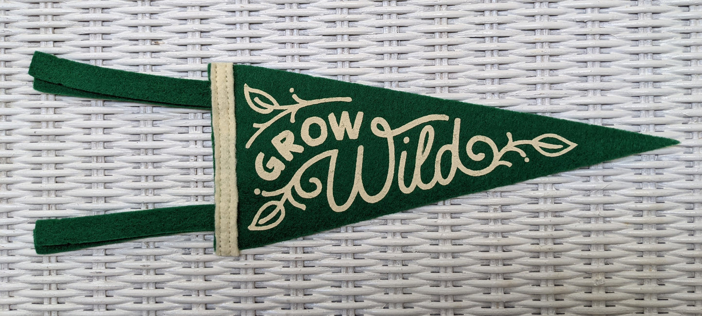 Mini green and white pennant reading Grow Wild by Poppy & Quail