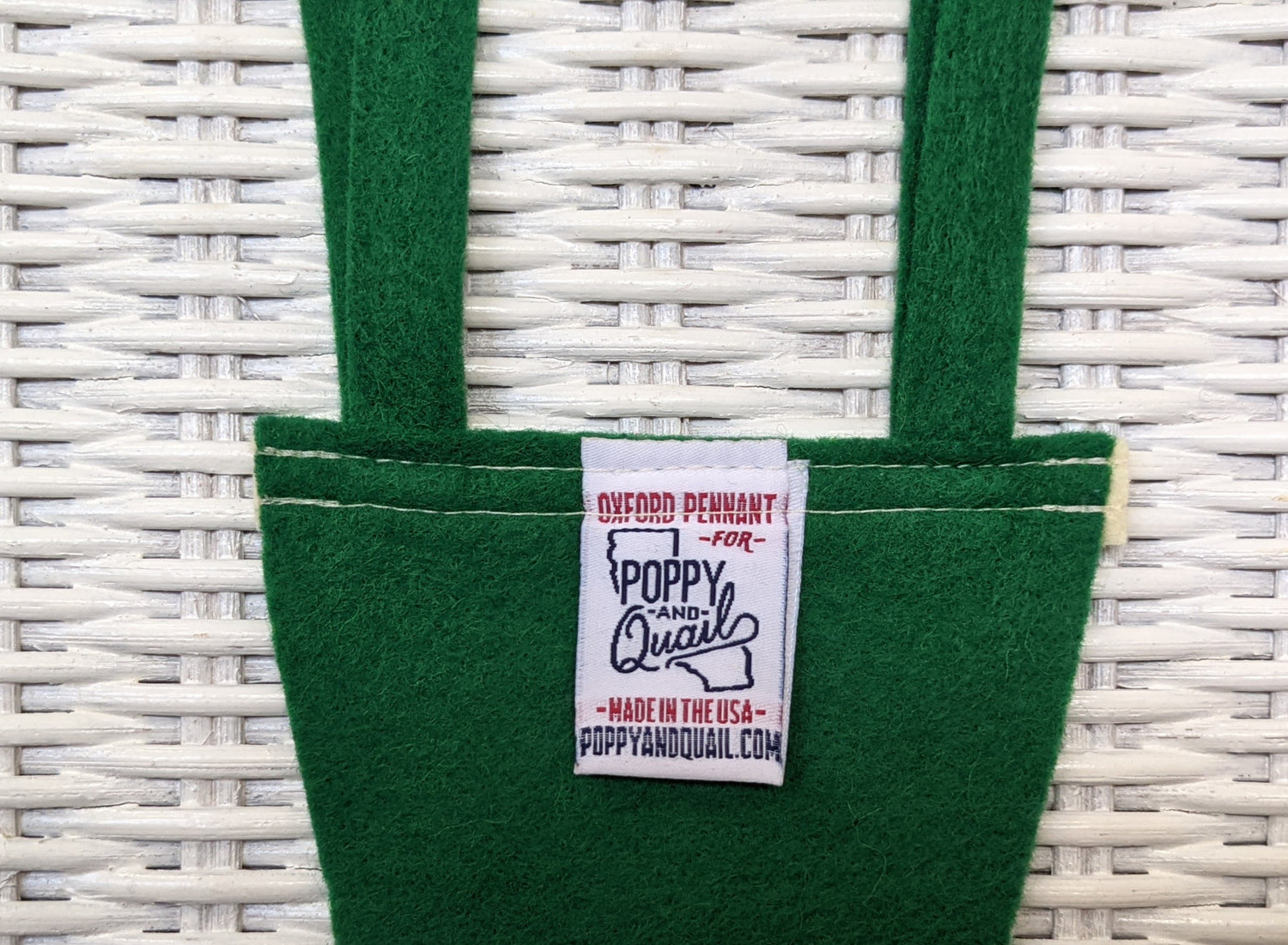 Back of mini green pennant with tag Made in USA by Oxford Pennant and by Poppy & Quail