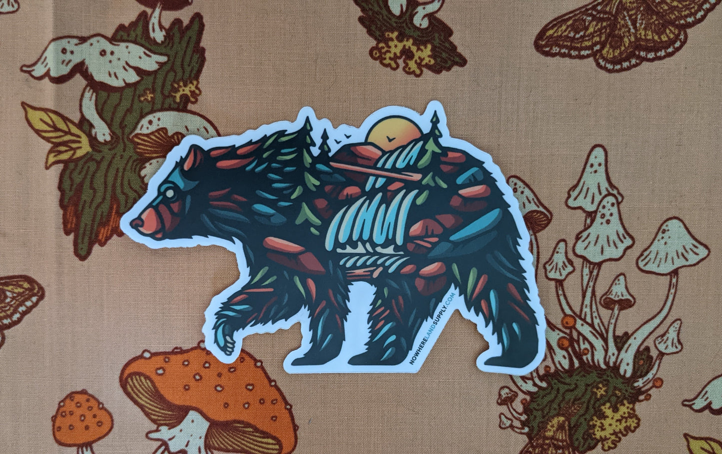 Bear shaped nature scene sticker by Nowhereland with forest background