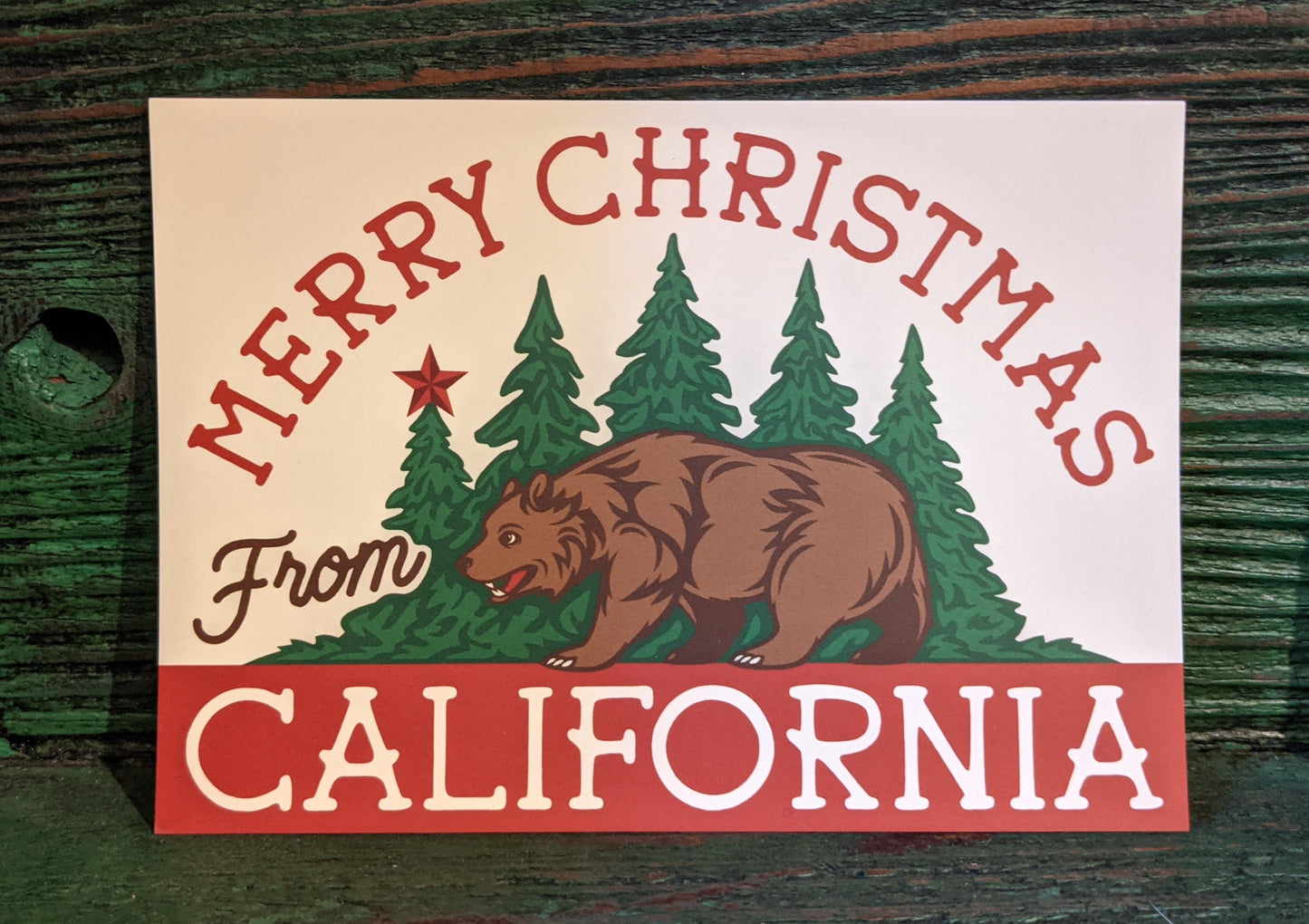 Merry Christmas from California postcard with design like CA flag with forest by Poppy & Quail