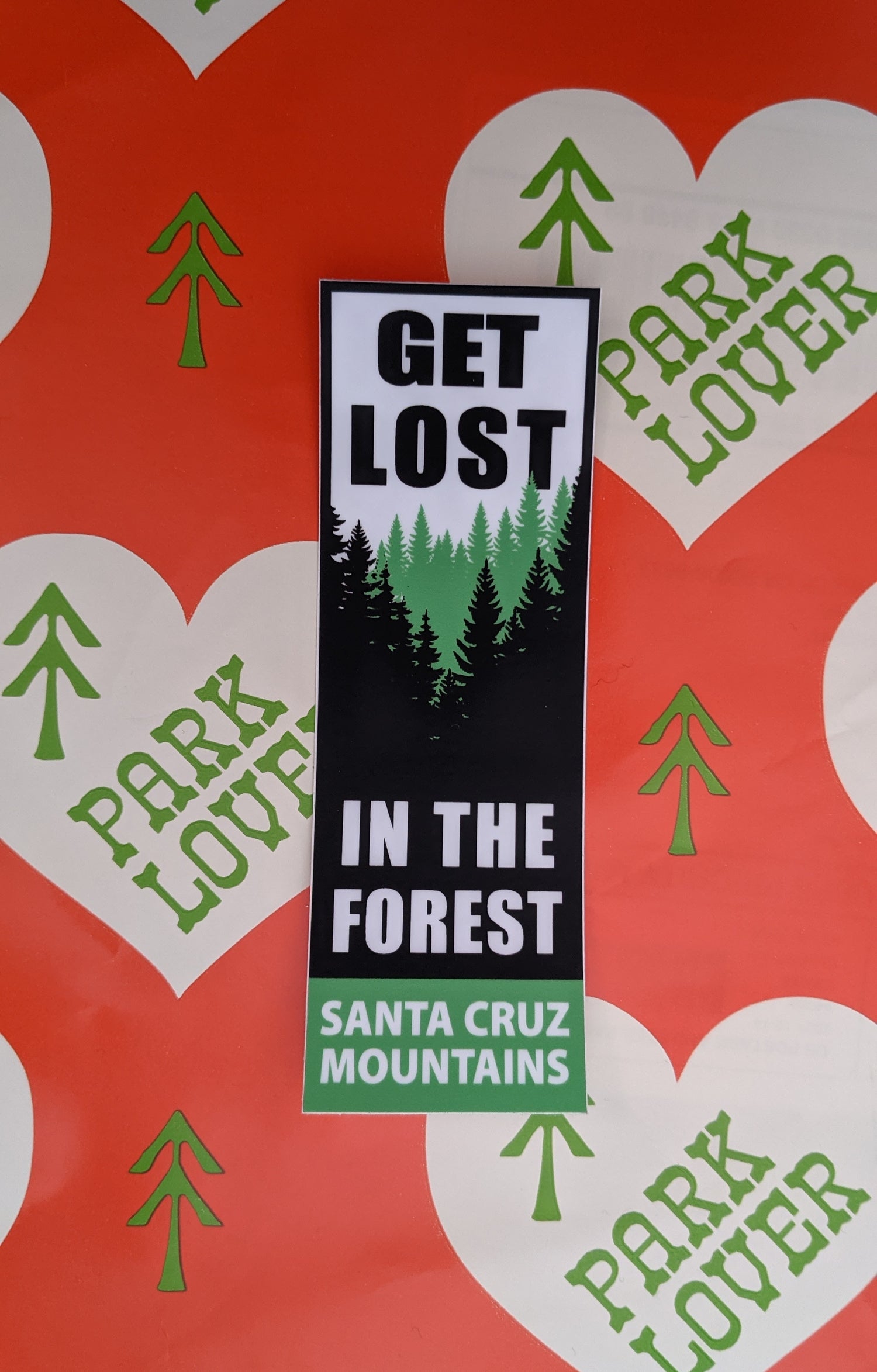 Get Lost in the Forest sticker by SCM Clothing with red Park Lover background 