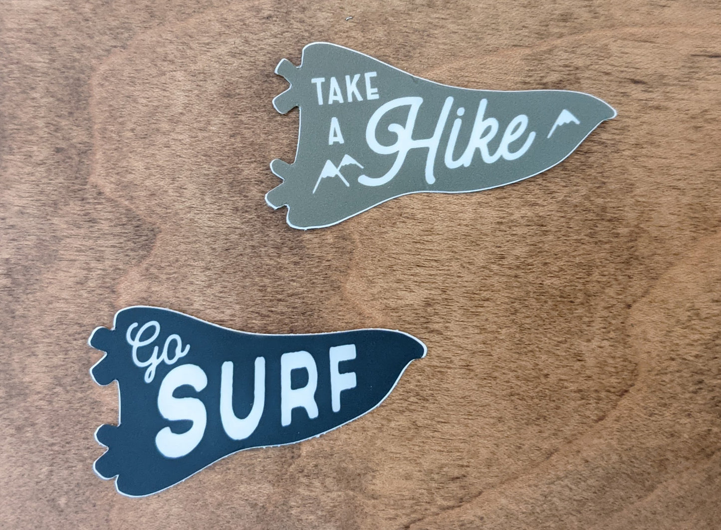 Mini pennant stickers reading Take a Hike in green and Go Surf in Navy by Pau Hana Designs