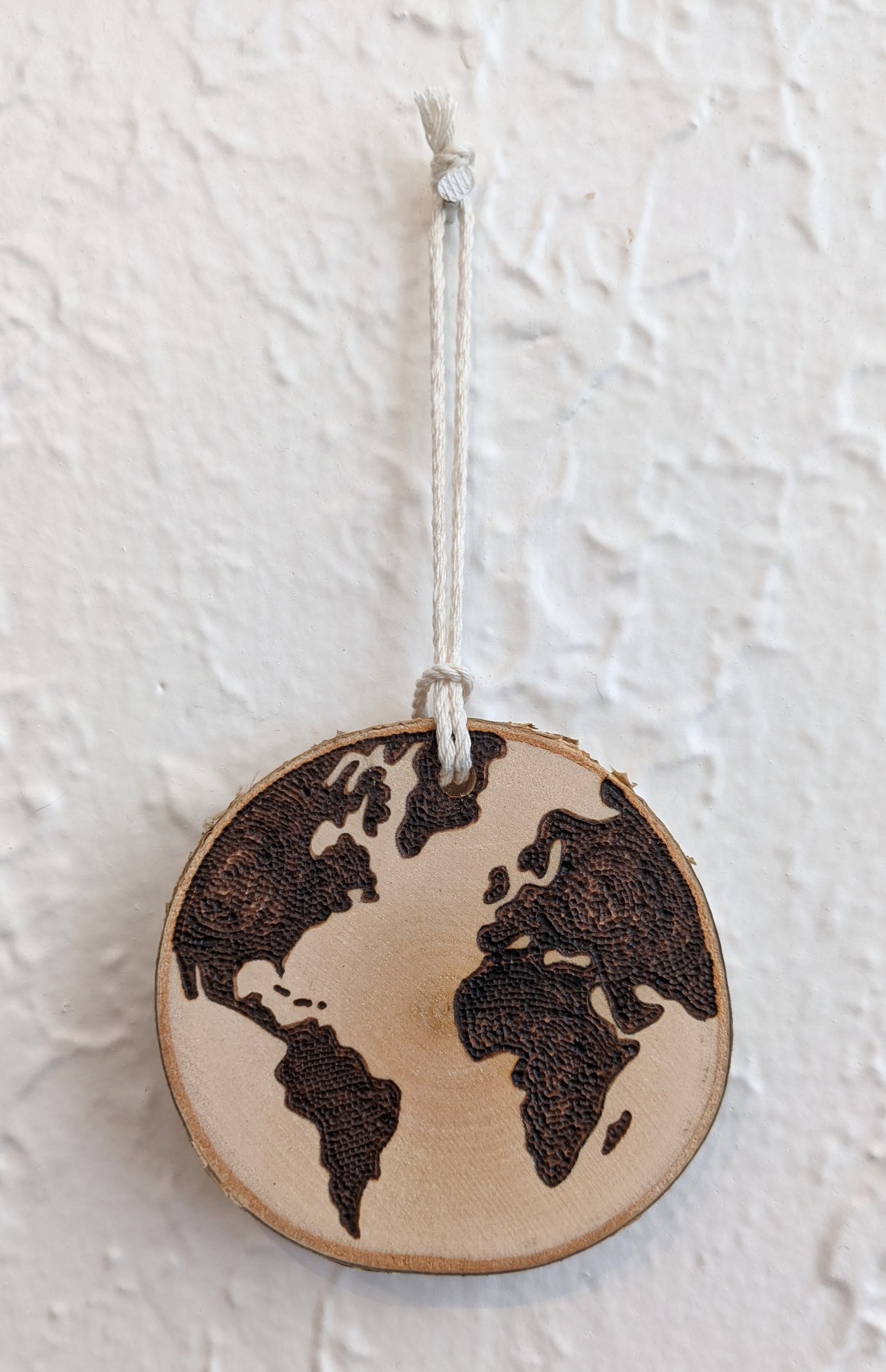 Wood burned Art by Wood Wanderlust ornament with world design