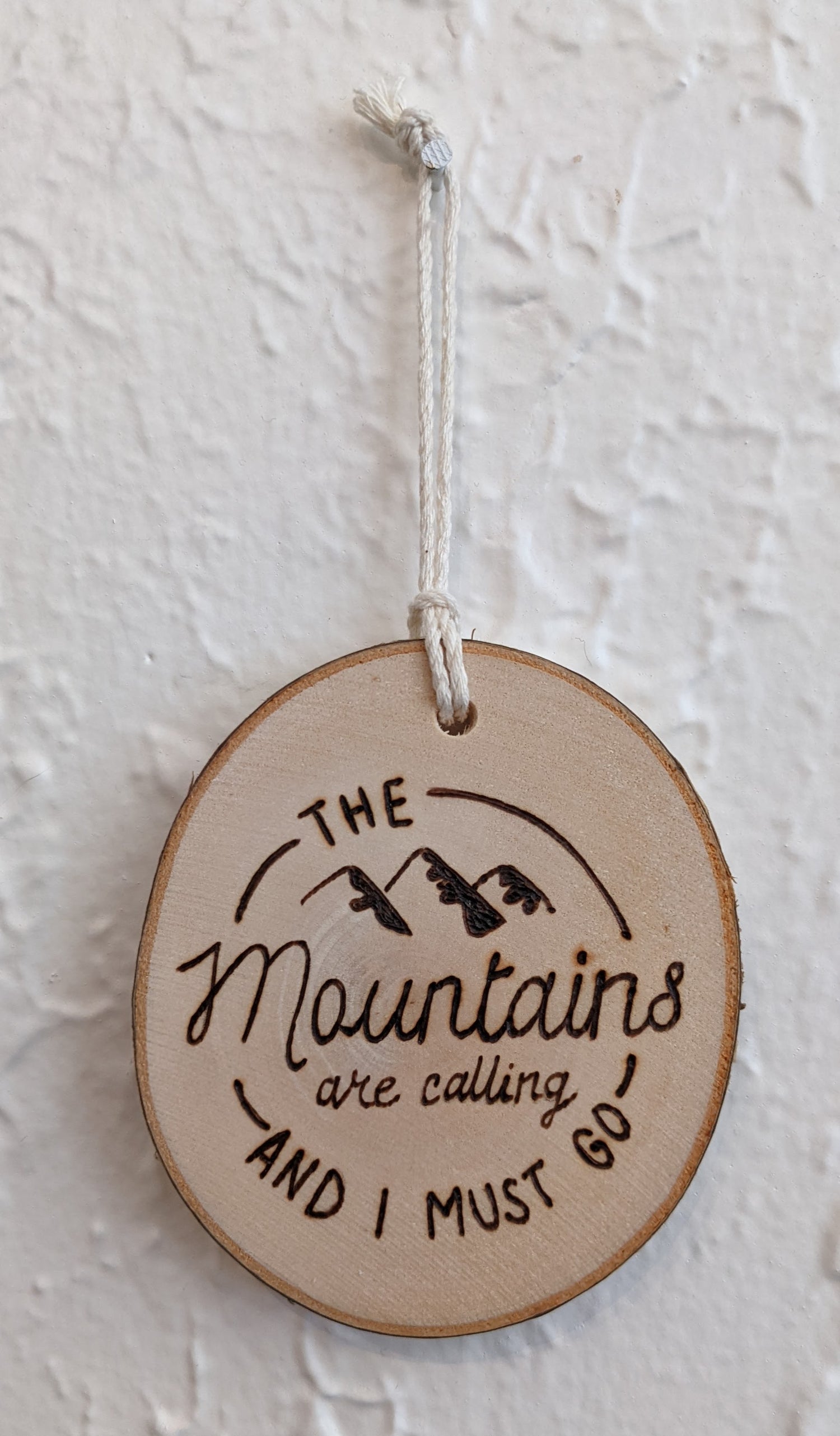 Wood burned Art by Wood Wanderlust - the mountains are calling and I must go, text art on ornament