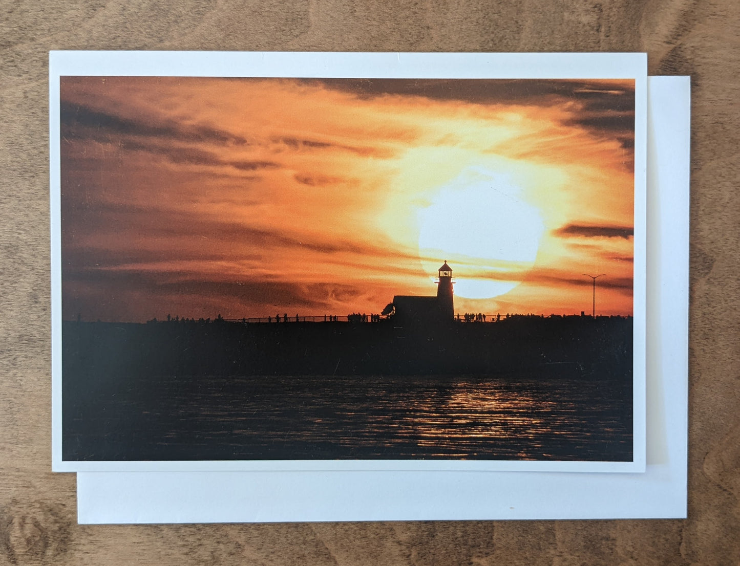 Local photography card by Sean McLean with white envelope, with lighthouse sunset design