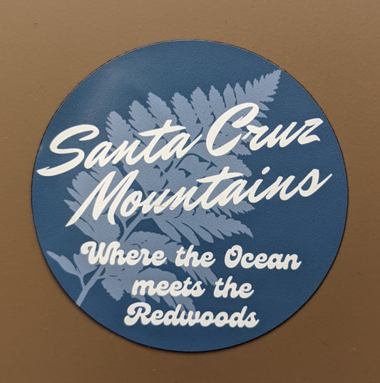 Mountain Talk blue round magnet reading Santa Cruz Mountains, Where the Ocean meets the Redwoods, with a fern design