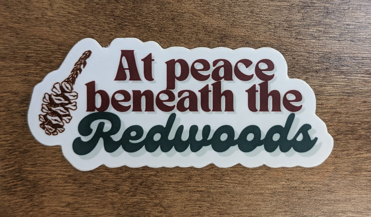 Mountain Talk sticker reading At peace beneath the Redwoods