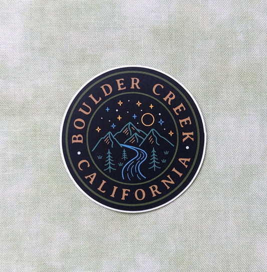 Round Black sticker with Boulder Creek, California words and nighttime mountain scene