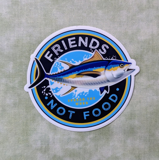 Round sticker reading "Friends, not food" with tuna fish, created by Jackie from Present