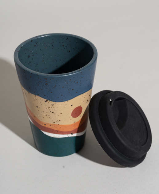 Stoneware travel mug with lid off by United by Blue