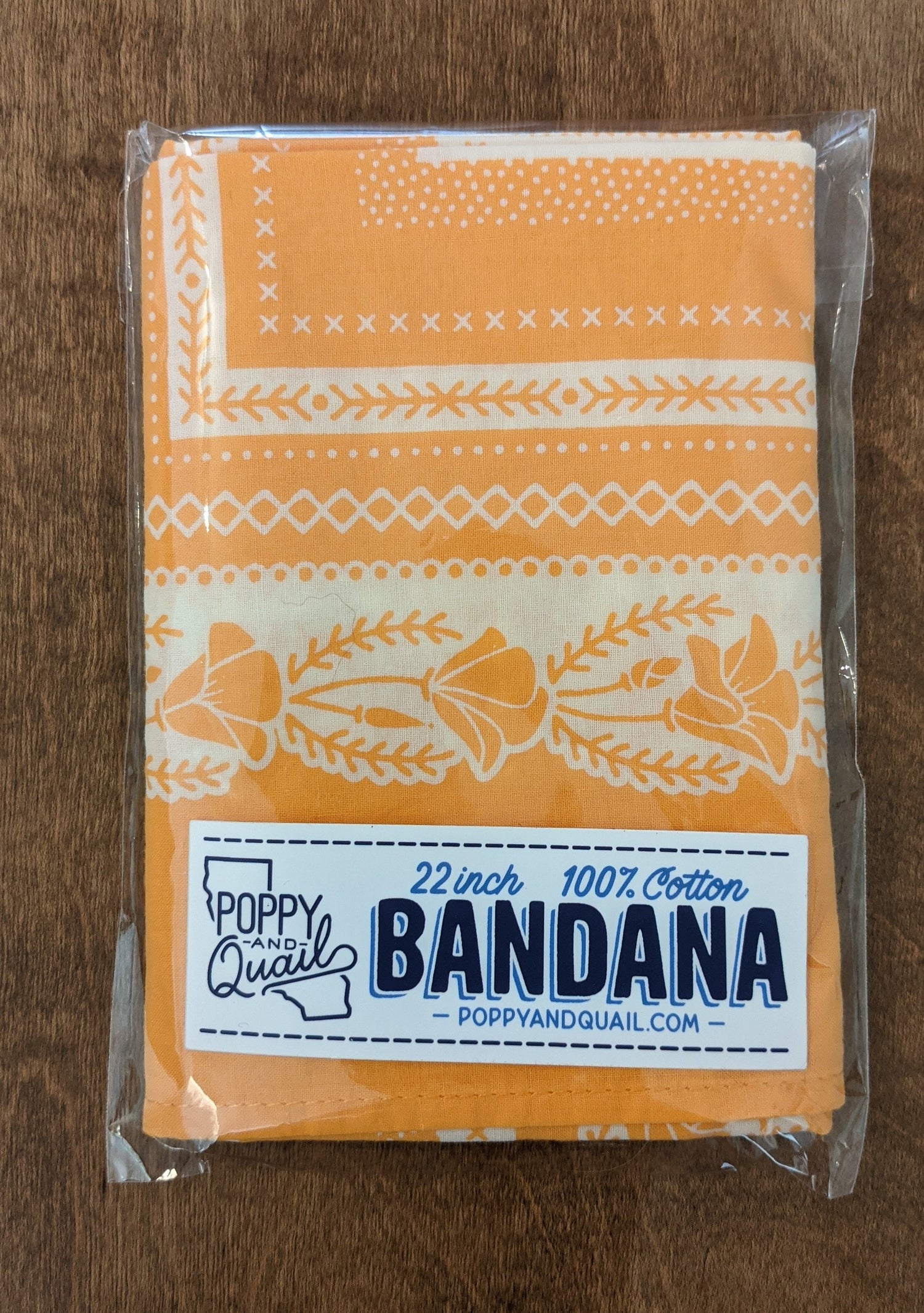 Orange poppy bandana folded and packaged by Poppy & Quail