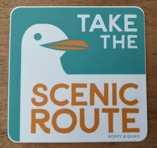 Square sticker with seagull by by Poppy & Quail reading "Take the Scenic Route"